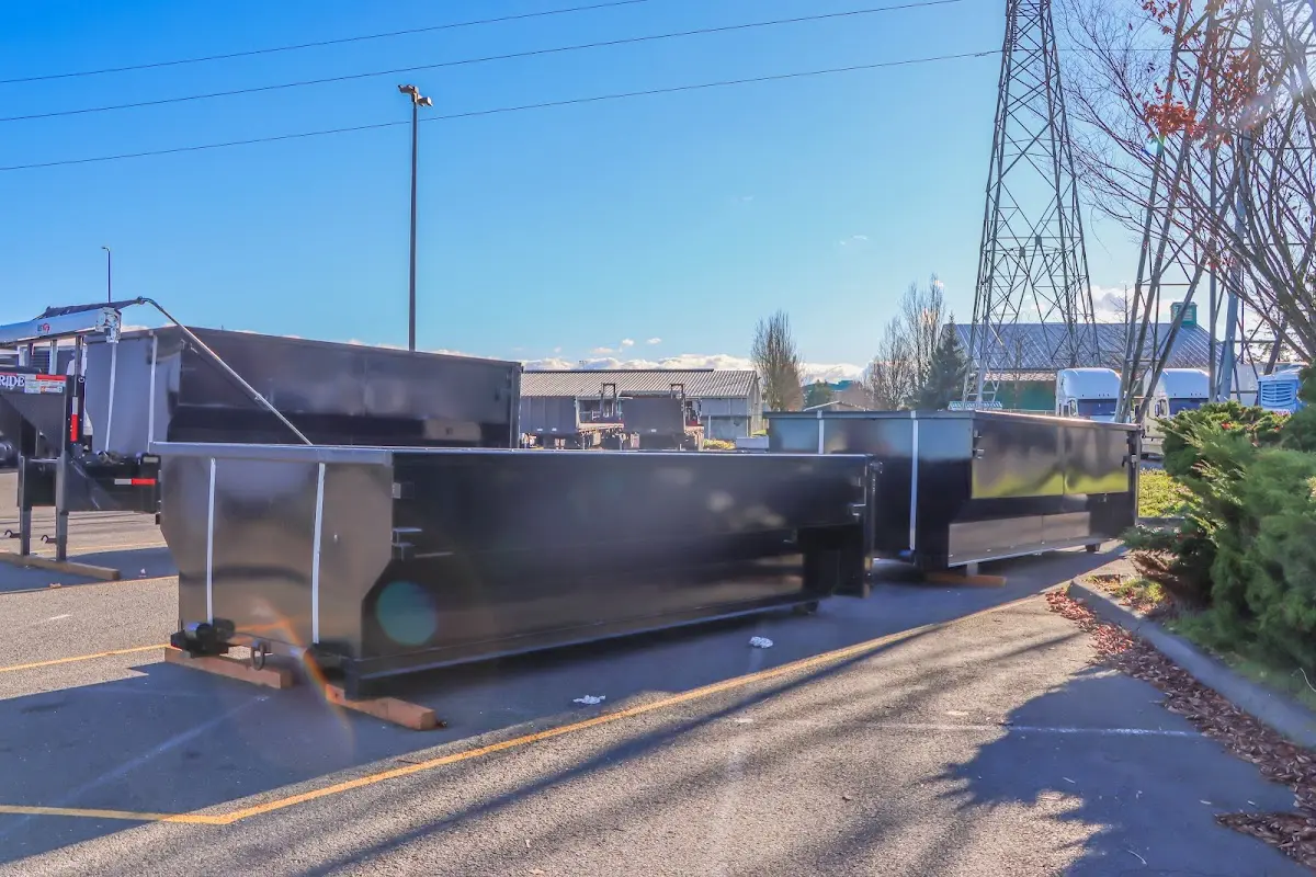 Roll-off dumpster ready for waste disposal at job site for Construction Dumpster Rental in East Camden
